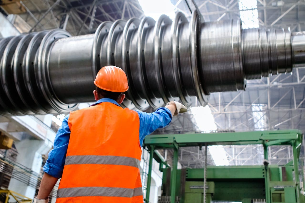 Engineer inspecting heavy industrial machinery